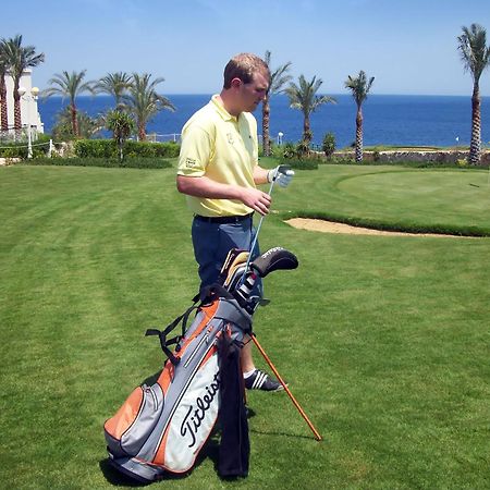 فندق وسبا ستيلا دي ماري بيتش شرم الشيخ المظهر الخارجي الصورة Golf player with a golf bag